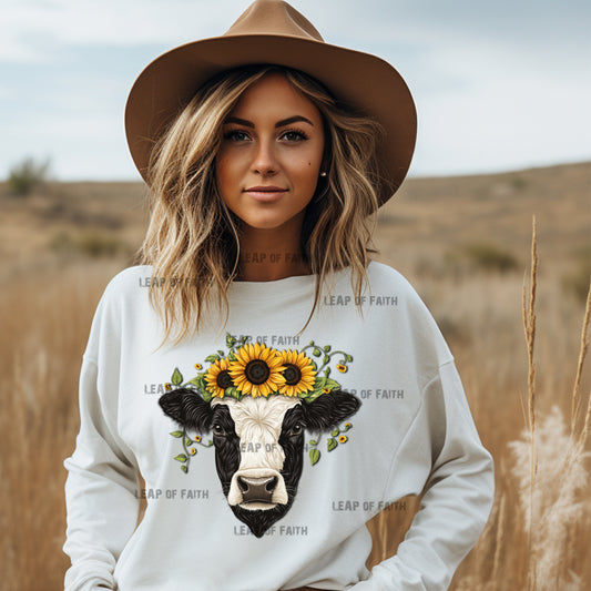 Cow with sunflowers